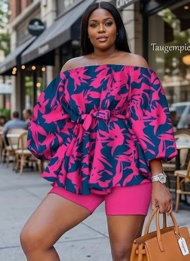 The Bloom Two-Piece Set is confidence in print form. A vibrant hot pink floral pattern bursts across a deep navy off-shoulder peplum top with voluminous balloon sleeves — cinched at the waist with a matching belt tie and paired with solid hot pink biker shorts that complete the look with intention.