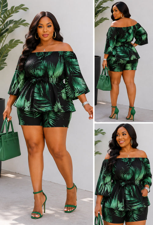 The Botanical Breakthrough Canopy Two-Piece Set is for the women who moves through the world with quiet power. &nbsp;A dramatic black-and-green tropical leaf print flows across an off-shoulder peplum top with balloon sleeves-cinched at the waist with a matching belt tie and grounded by sleek coordinating biker shorts.&nbsp;