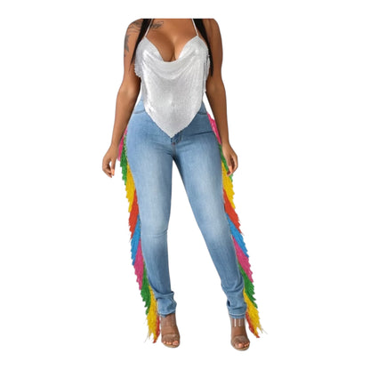 Light denim. Heavy presence. The Carnival Fringe Jean in Light Wash brings sun-washed ease to a full-length rainbow fringe cascade — effortless on the surface, impossible to ignore in person.