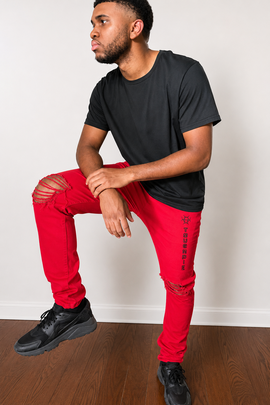 Not for the hesitant. Crimson Discipline Denim is a full statement — bold red colorway, distressed knees, and the TAUGEMPIE mark for the man who dresses with conviction.