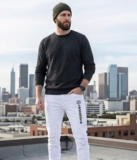 Frost Denim is the all-white statement done with intention — distressed detail, branded logo, and a fit that commands respect without saying a word.

