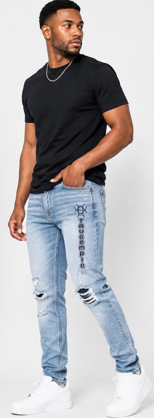 The original, reimagined. Indigo Discipline Denim brings classic blue denim into TAUGEMPIE’s world — slim fit, branded logo, distressed knees, and a stretch blend that moves with purpose.