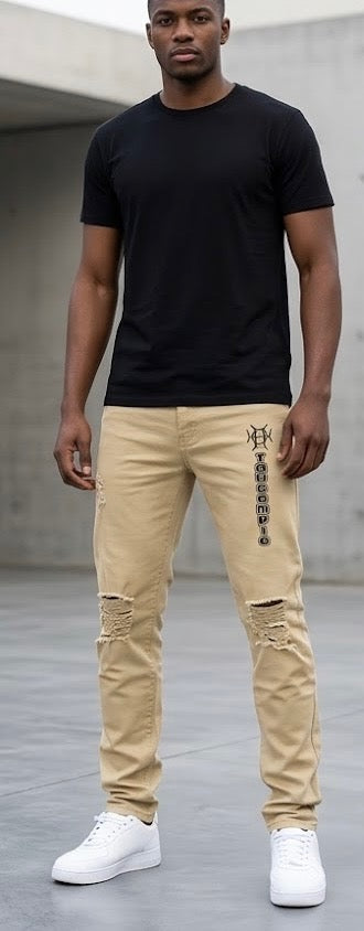 Versatile by design. Sand Discipline Denim is the neutral that works harder than it looks — warm khaki tone, distressed knees, and the TAUGEMPIE mark for the man who builds with intention.
