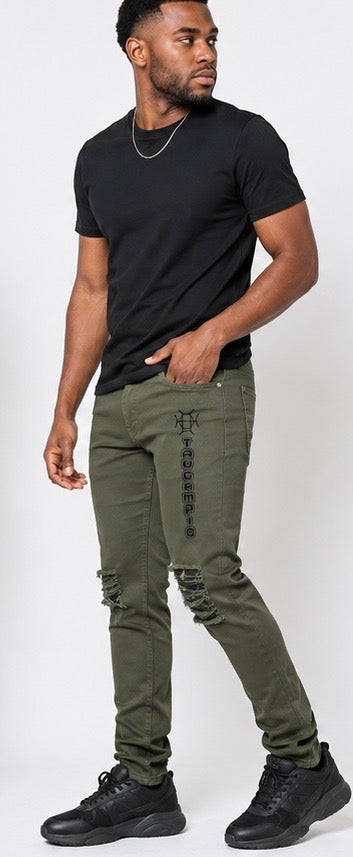 Built for the field and the culture. Terrain Discipline Denim channels military heritage into elevated streetwear — army green, distressed detail, and the TAUGEMPIE mark for the man who moves with purpose.
