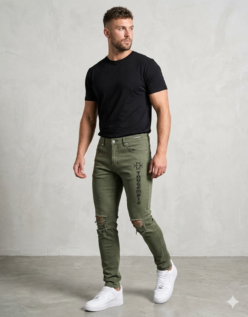 Built for the field and the culture. Terrain Discipline Denim channels military heritage into elevated streetwear — army green, distressed detail, and the TAUGEMPIE mark for the man who moves with purpose.