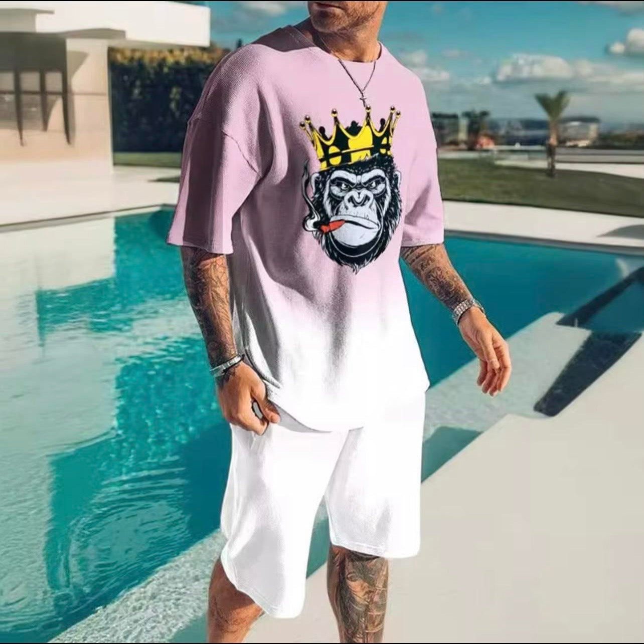 Model wearing Men's pink gradient satin 2-piece short set with smoking king ape graphic | TAUGEMPIE