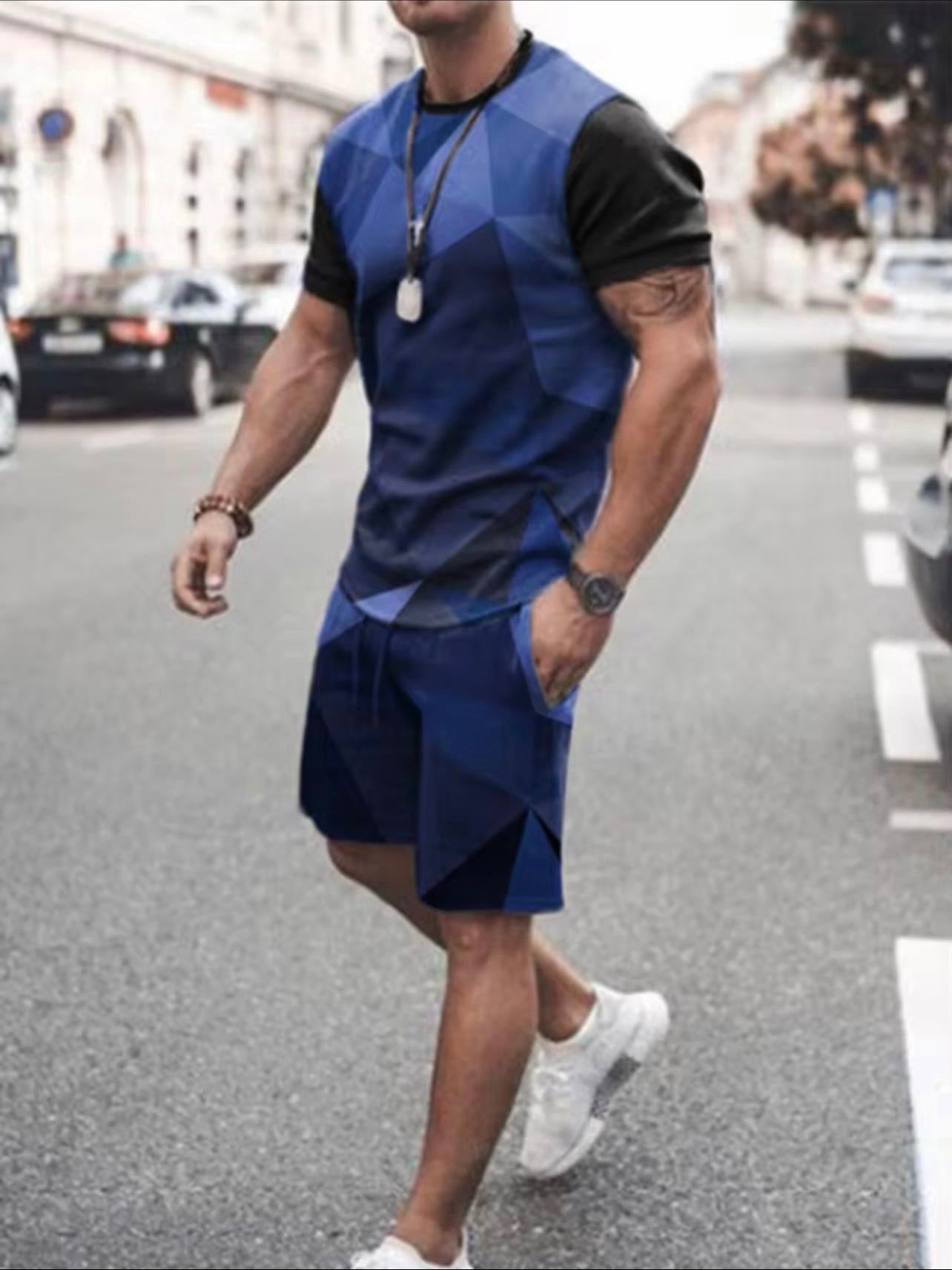 Model wearing Men's geometric mosaic blue and black satin 2-piece short set | TAUGEMPIE