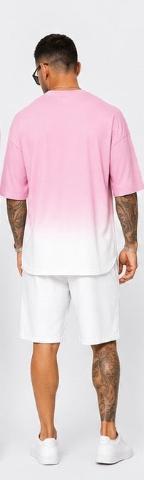 Kings don’t blend in. The Crown Set is a full cultural moment — pink-to-white gradient, crowned gorilla graphic, and clean white shorts for the man who wears confidence like a uniform.
