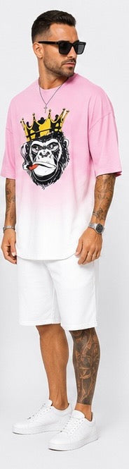 Kings don’t blend in. The Crown Set is a full cultural moment — pink-to-white gradient, crowned gorilla graphic, and clean white shorts for the man who wears confidence like a uniform.
