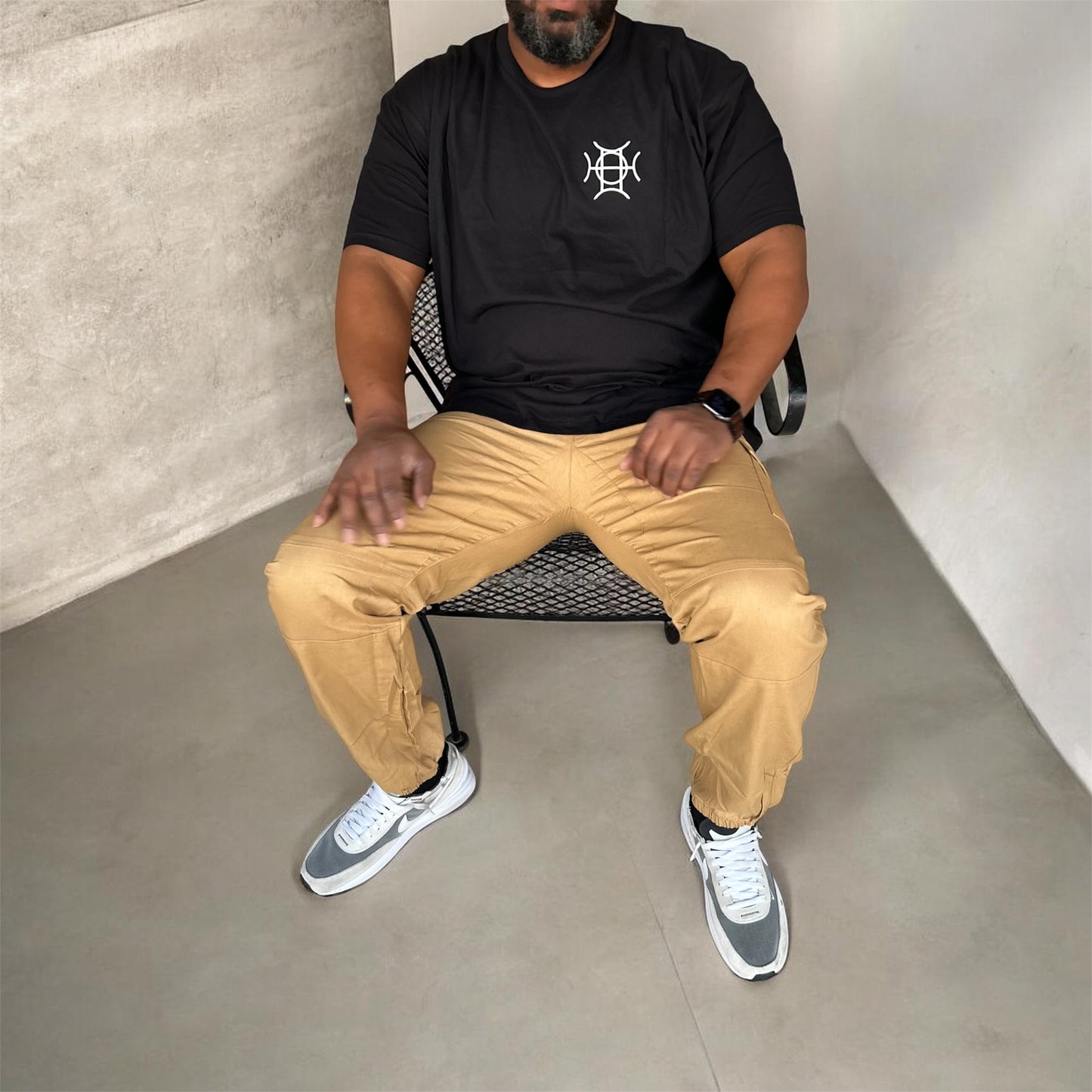 Black is the baseline of every serious wardrobe — and The Mark Crew elevates it. A 100% cotton crewneck in deep black carries the TAUGEMPIE crest mark on the left chest and the full signature logo graphic across the back. Front and back, the brand speaks.