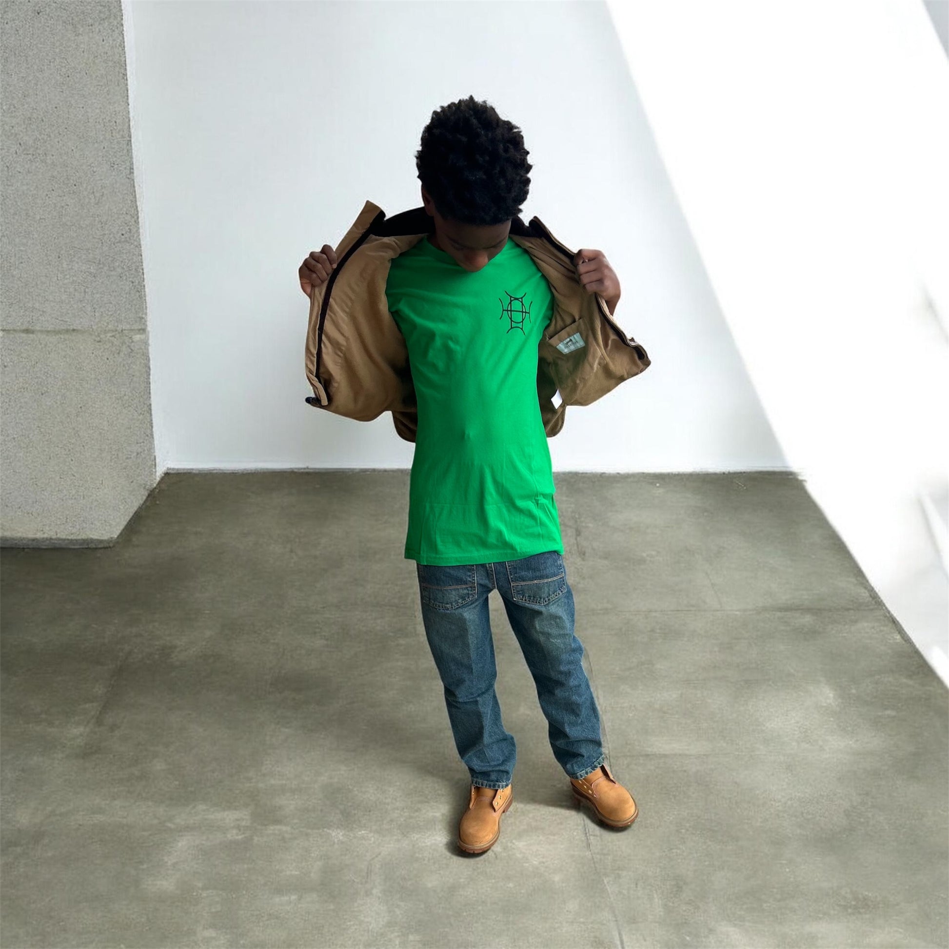 The Mark Crew in Green is the piece for who moves with purpose. A rich kelly green 100% cotton crewneck carries the TAUGEMPIE crest mark on the left chest and the full signature logo graphic across the back — clean on the front, statement on the back.