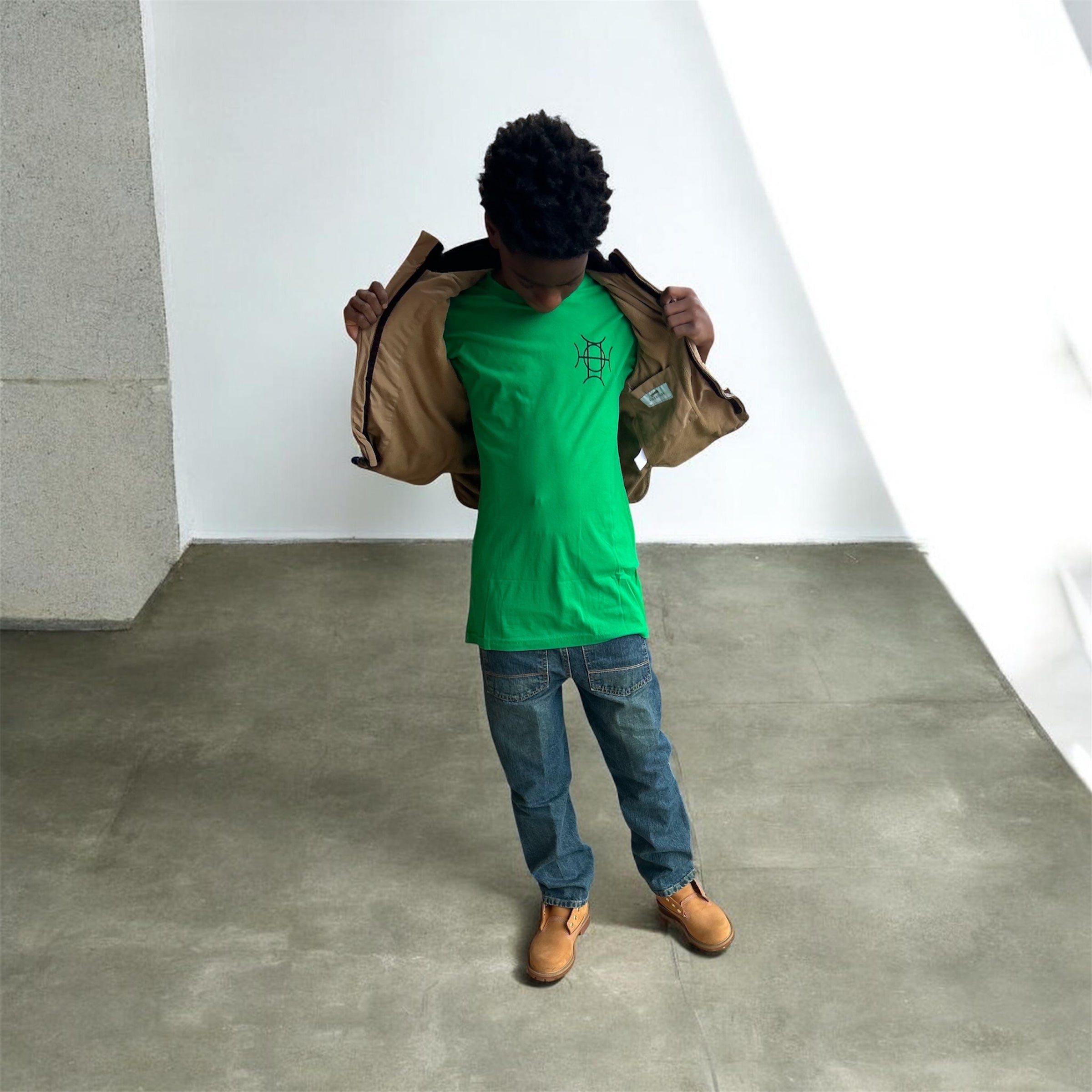 The Mark Crew in Green is the piece for who moves with purpose. A rich kelly green 100% cotton crewneck carries the TAUGEMPIE crest mark on the left chest and the full signature logo graphic across the back — clean on the front, statement on the back.