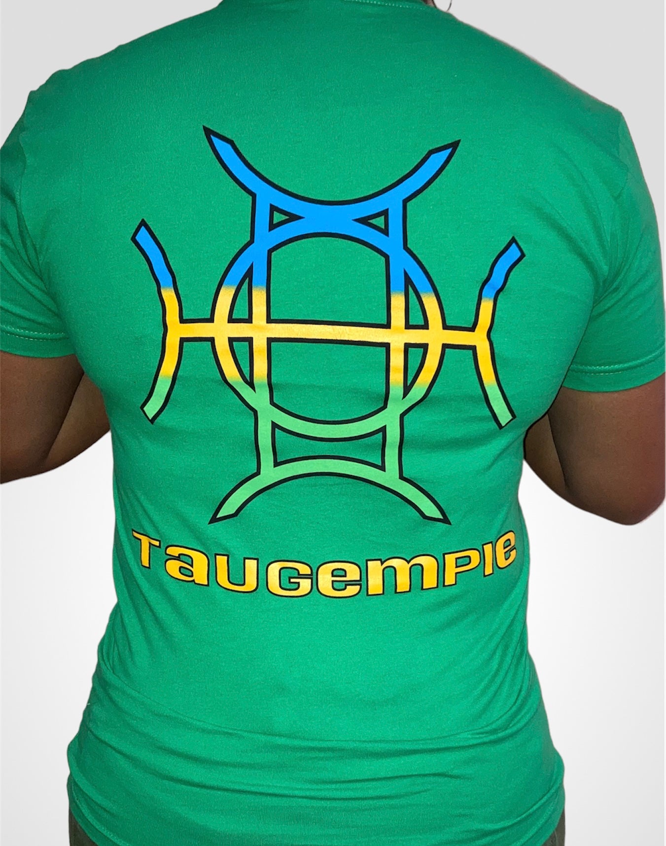 The Mark Crew in Green is the piece for who moves with purpose. A rich kelly green 100% cotton crewneck carries the TAUGEMPIE crest mark on the left chest and the full signature logo graphic across the back — clean on the front, statement on the back.