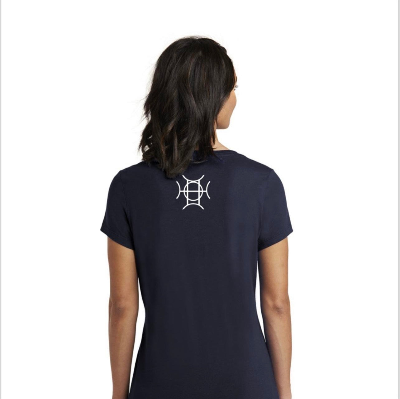 Every brand has a mark. TAUGEMPIE wears theirs. The Mark Tee in Navy is the foundation piece of the TAUGEMPIE collection — a deep navy 100% cotton v-neck built with the signature logo graphic in blue, green, and gold positioned center chest where it belongs.