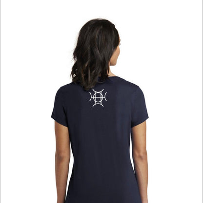 Every brand has a mark. TAUGEMPIE wears theirs. The Mark Tee in Navy is the foundation piece of the TAUGEMPIE collection — a deep navy 100% cotton v-neck built with the signature logo graphic in blue, green, and gold positioned center chest where it belongs.