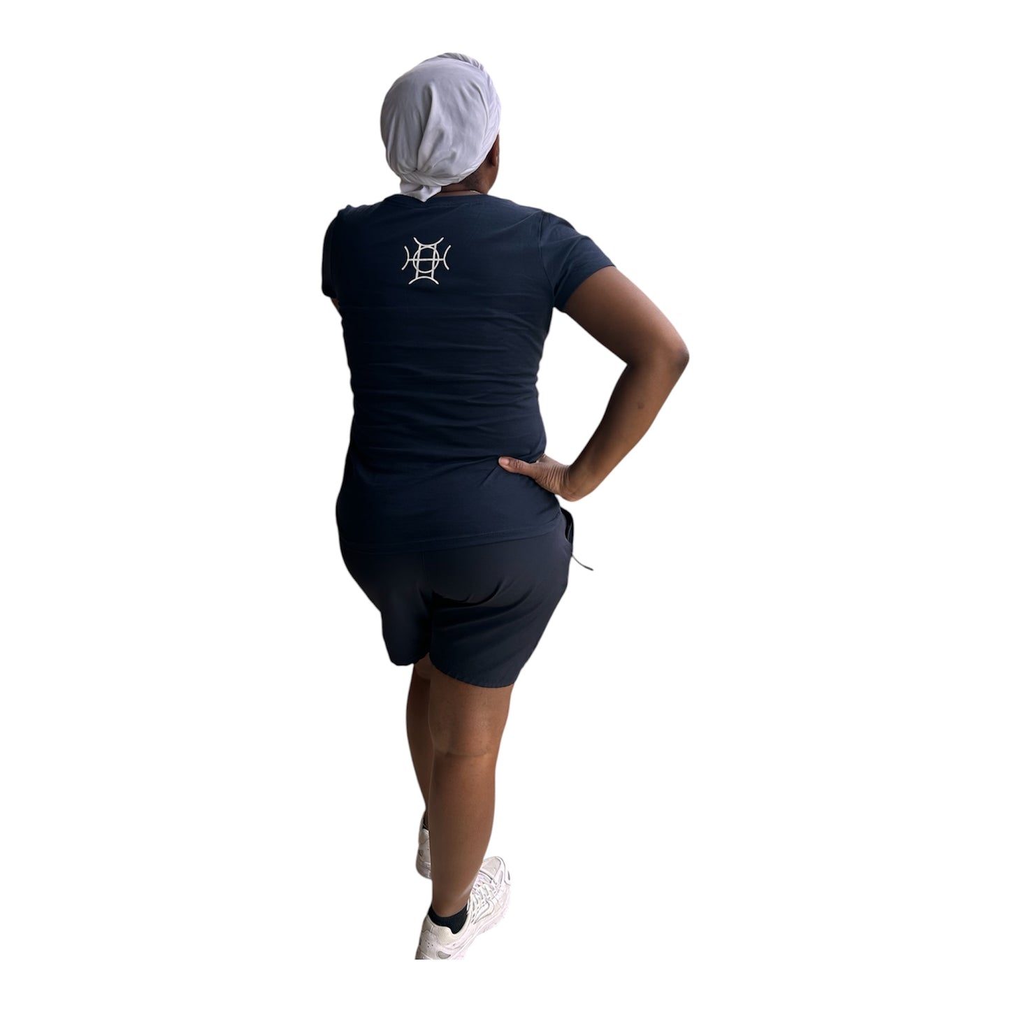 Every brand has a mark. TAUGEMPIE wears theirs. The Mark Tee in Navy is the foundation piece of the TAUGEMPIE collection — a deep navy 100% cotton v-neck built with the signature logo graphic in blue, green, and gold positioned center chest where it belongs.