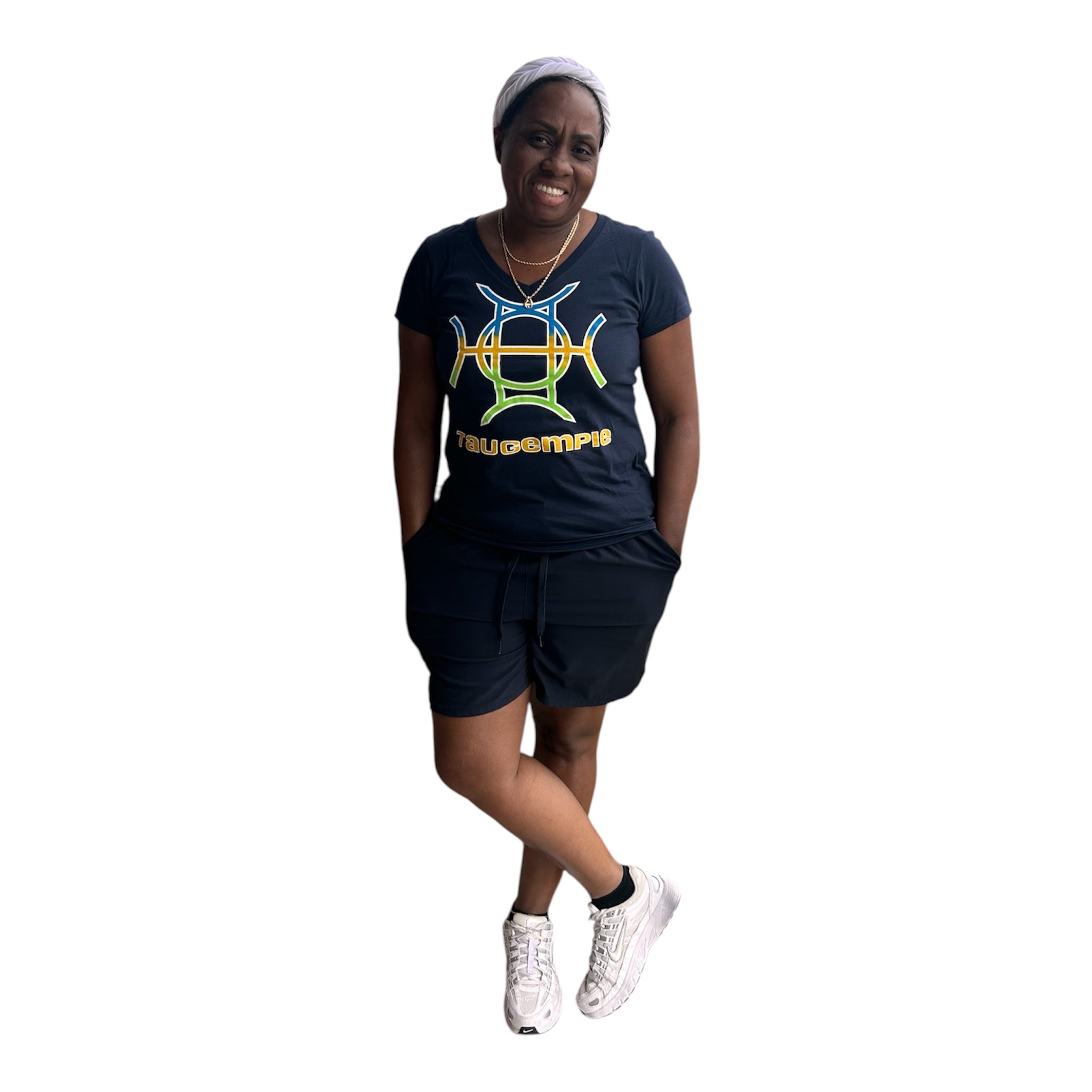 Every brand has a mark. TAUGEMPIE wears theirs. The Mark Tee in Navy is the foundation piece of the TAUGEMPIE collection — a deep navy 100% cotton v-neck built with the signature logo graphic in blue, green, and gold positioned center chest where it belongs.
