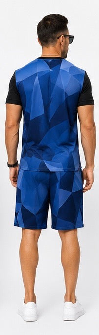 The Prism Set is built for the man who moves with purpose. A bold geometric diamond print in deep navy and black covers a fitted crewneck tee — structured, angular, and unmistakably intentional. Paired with clean navy shorts that ground the look with simplicity.