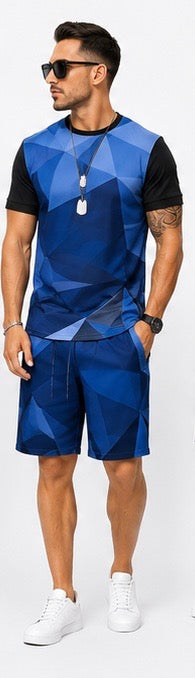 The Prism Set is built for the man who moves with purpose. A bold geometric diamond print in deep navy and black covers a fitted crewneck tee — structured, angular, and unmistakably intentional. Paired with clean navy shorts that ground the look with simplicity.