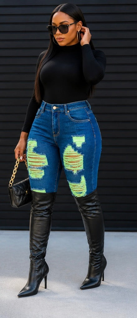 The Voltage Shredded Jean in Green is controlled chaos — in the best way. Neon green accent stitching electrifies deliberately shredded distress points, creating a look that balances edge with attitude and street with elevation.