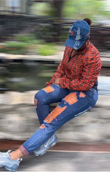 Heat you can wear. The Voltage Jean in Orange brings neon fire to distressed denim — bold orange accent stitching, shredded detail, and a stretch fit that commands attention without asking for it.